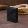 Вертикальное глянцевое портмоне с накладной монетницей GRANDE PELLE 11329 Черное